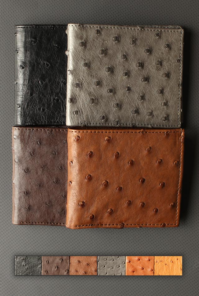 Four ostrich wallets are seen in four different colors. The colors are black, grey, dark brown and a medium brown. There is also a color block below the wallets showing the six main colors that Struzzu wallets are available in.